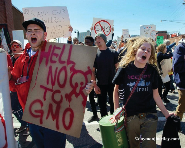 People at the Monsonto protests expressed outrage over the U.S. Congress and the President for having passed what is now called the “Monsanto Protection Act.” It, among other things, bans courts from halting the sale of Monsanto’s genetically modified seeds. The act also protects Monsanto from ever being legally sued for health complications from eating GMO foods. Photos/Daymonjhartley.com