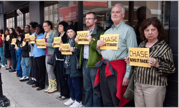 Protesters in Chicago demand to meet with regional JPMorgan executive about home foreclosures. PHOTO/THEE ERIN