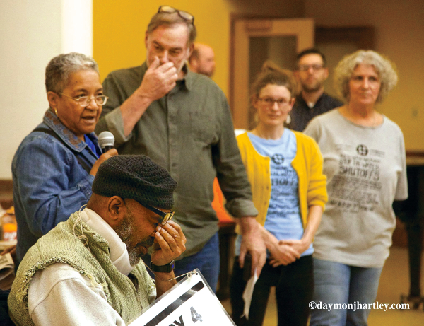 Five of the Homrich 9 defendants. They are charged with civil disobedience for blocking trucks contracted by Detroit’s governor appointed Emergency Manager to shut off people’s water. Democracy was attacked further in the trial of two defendants. Prosecutors, fearing they were going to lose the case, dismissed the jury and put the trial on hold. PHOTO/DAYMONJHARTLEY.COM