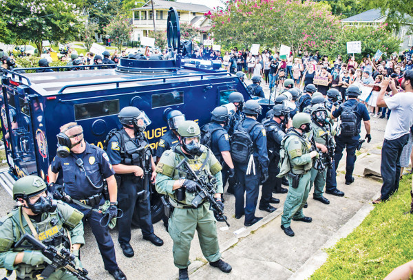Non-violent protesters of the police killing of Alton Sterling are met by heavily armed police response in Baton Rouge, Louisiana. ABOVE AND BOTTOM-RIGHT PHOTOS/JULIE DERMANSKY