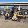 Heavy equipment destroys a houseless community