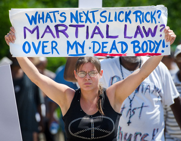 Rebecca Fritz marches in Detroit with a coalition of groups in solidarity against an Emergency Manager takeover of the city and other issues.