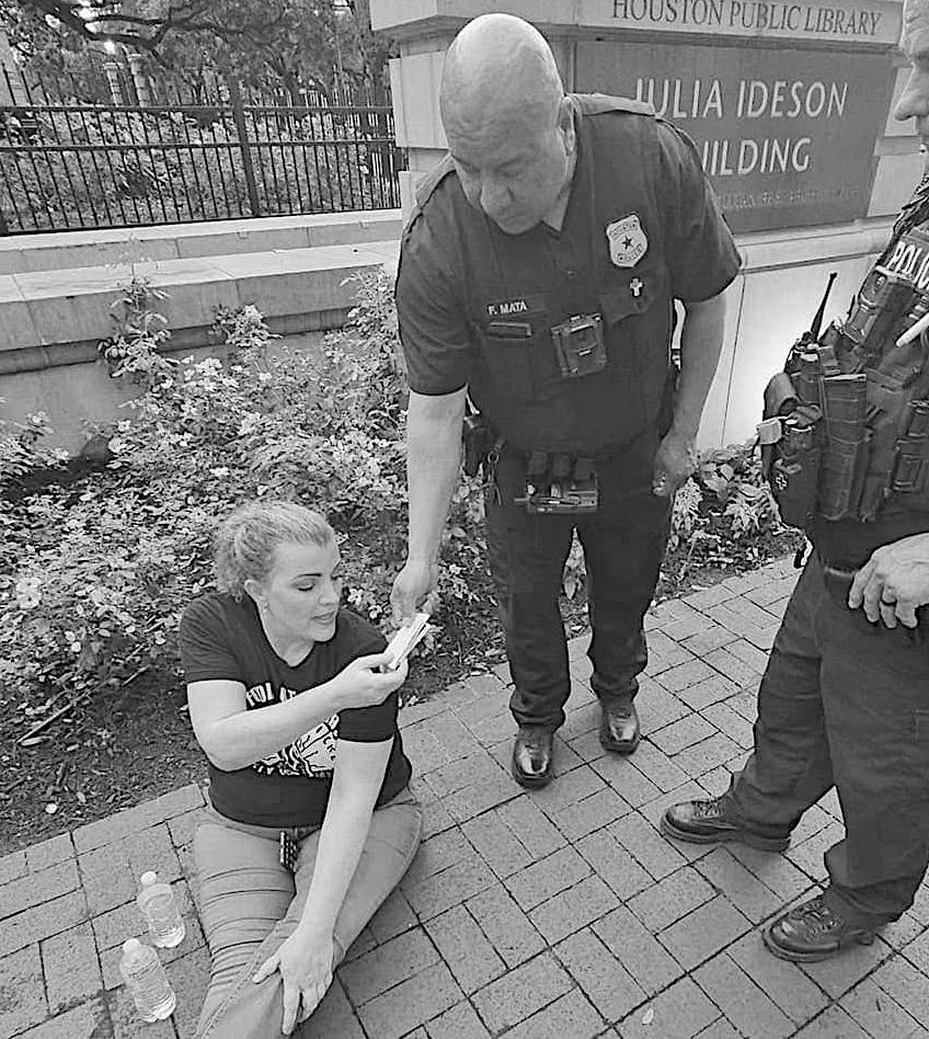 Volunteer at Food Not Bombs-Houston is ticketed for feeding hungry people in downtown Houston.
