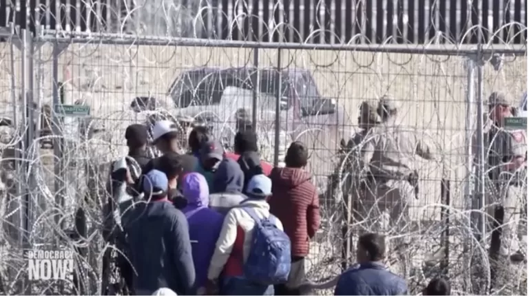immigrants trying to cross from Mexico into Texas face razor wire and national guard troops, March 2024