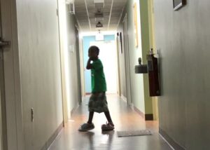 “Lucky” child in a shelter. Photo Diane Nilan