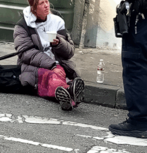 A woman is harassed by the cops during the sweep of a San Francisco alley / Photo Sarah Menefee