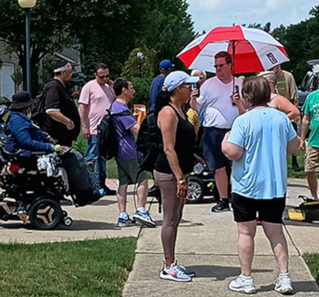 Scott Nance with the Alliance for Community Services rally at Rep. LaHood's home in Peoria, IL, to save Medicaid on 6/24/2025. Photo/Kathy Powers