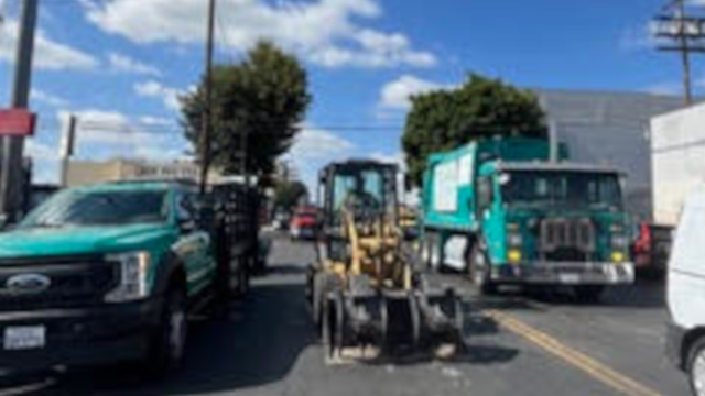 Sweeps underway in LA - dump trucks and bulldozers ready. Photo/Cathleen Williams