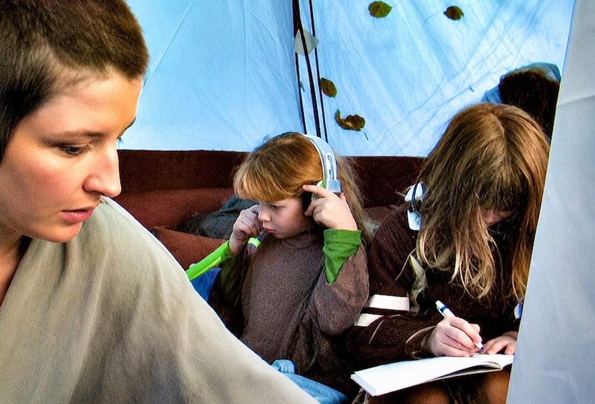 mother and children living in tent