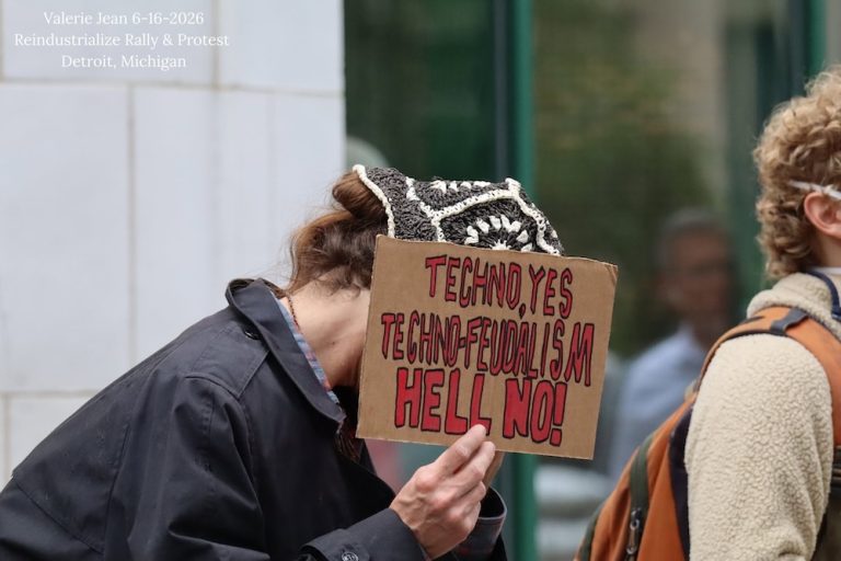 Detroiter protest Reindustrialization Conference that promotes war